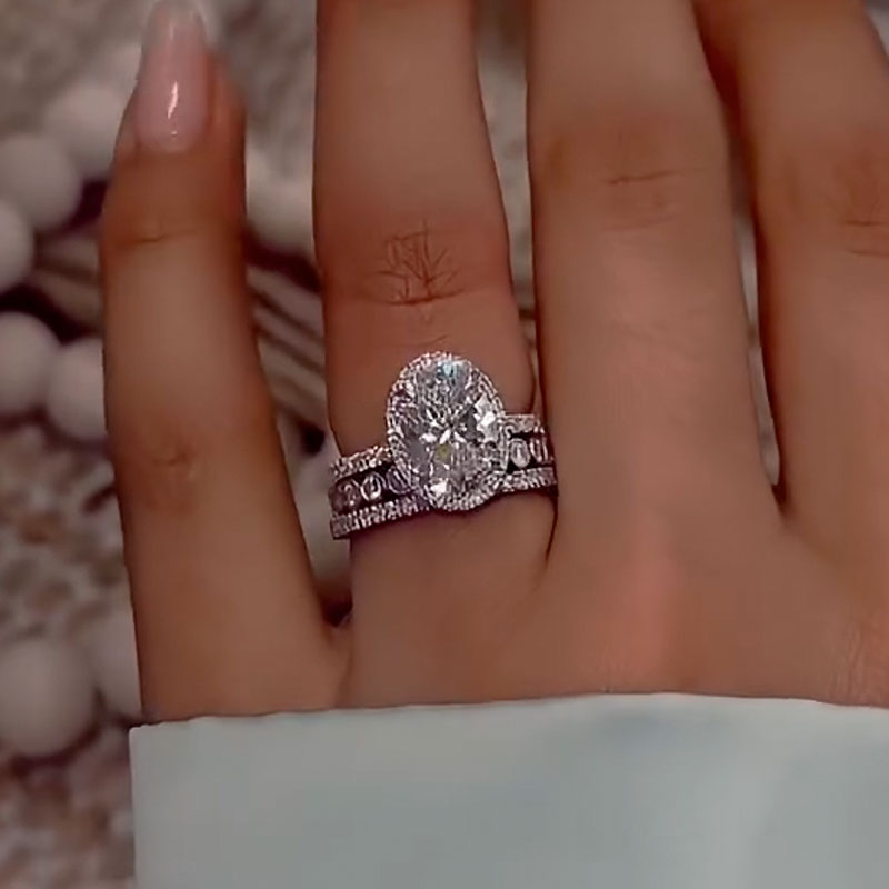 4Ct Oval Diamond Ring with Round Accents