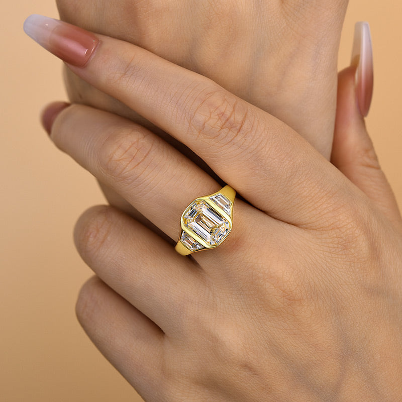 4.5Ct Emerald Cut Three-Stone Bezel Ring in Gold