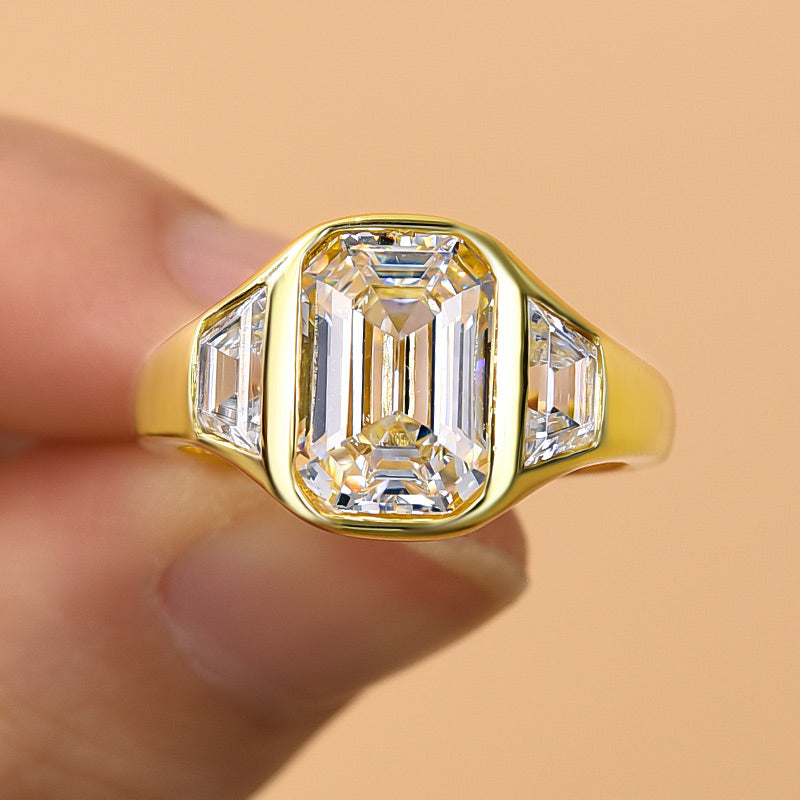4.5Ct Emerald Cut Three-Stone Bezel Ring in Gold
