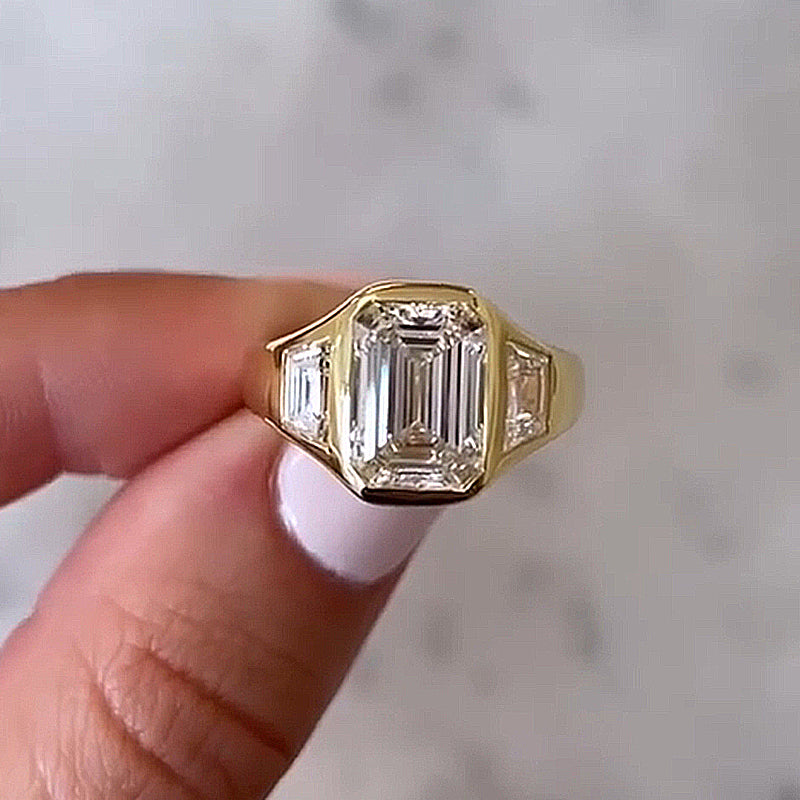 4.5Ct Emerald Cut Three-Stone Bezel Ring in Gold