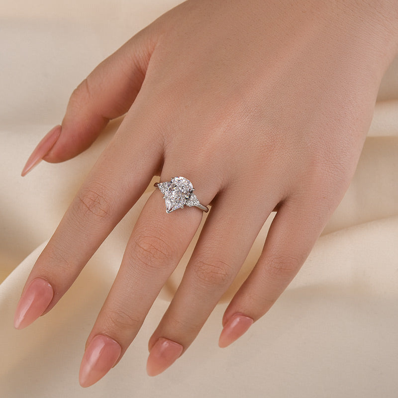 3.0ct Gold Pear Cut Simulated Diamond Ring with Side Stones