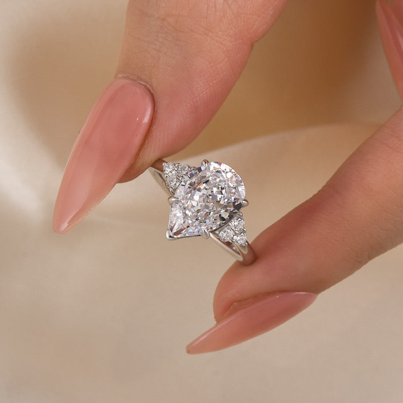 3.0ct Gold Pear Cut Simulated Diamond Ring with Side Stones