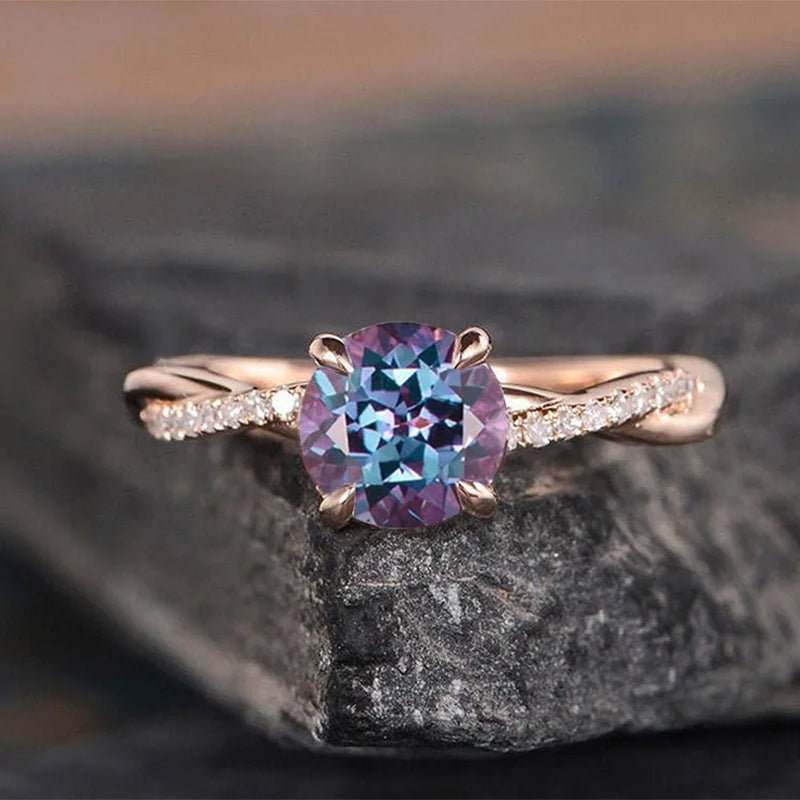 Rose Gold Alexandrite Pear Cut Twist Engagement Ring with Simulated Diamond