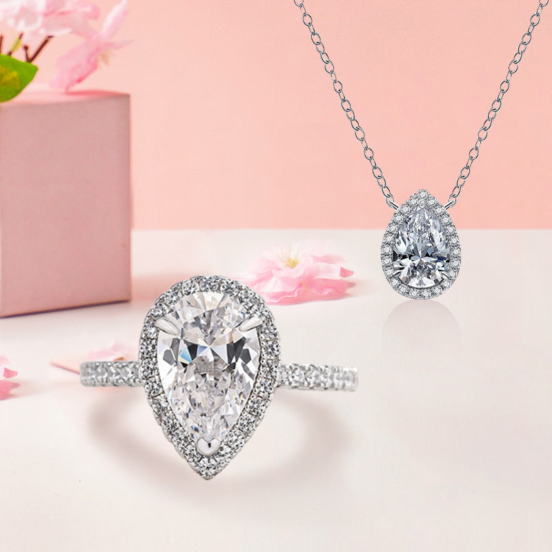 Conjunto de 2 joyas de diamantes simulados de talla pera en plata de ley y oro blanco.