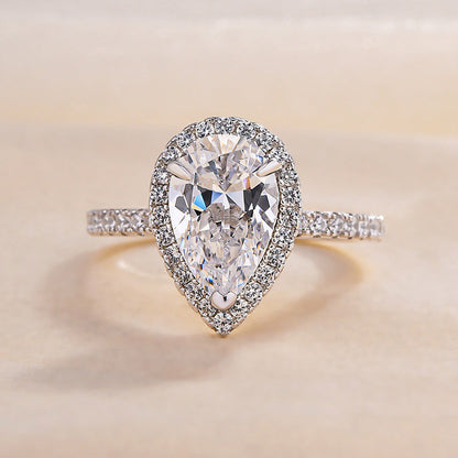 Conjunto de 2 joyas de diamantes simulados de talla pera en plata de ley y oro blanco. 