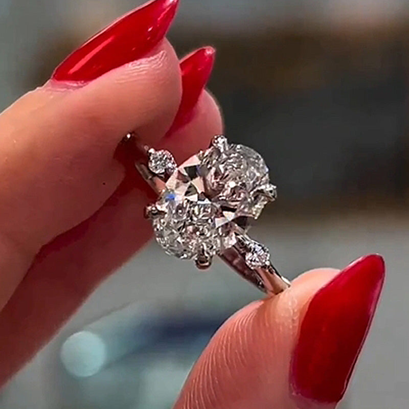 4Ct Oval Cut Diamond Ring with 0.5Ct Side Stones 925 Silver